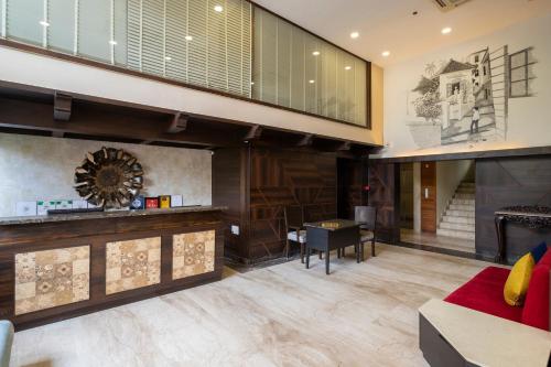 a living room with a couch and a fireplace at Varanda Do Mar in Panaji