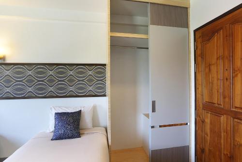 Postel nebo postele na pokoji v ubytování V Place Residence