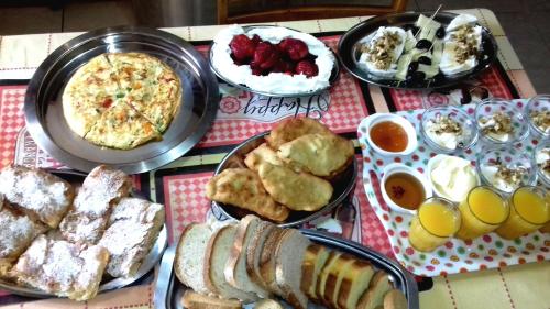 a table topped with different types of breakfast foods at Villa Alexandros in Zóla