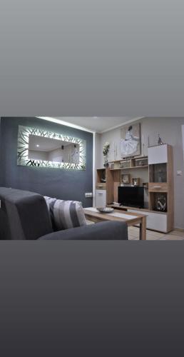 a living room with a couch and a table at Nina Apartment in Chania Town