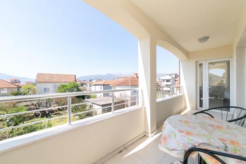 a balcony with a view of the city at Apartmani Tripović in Tivat