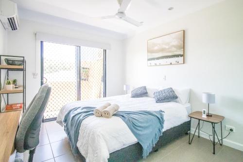 a bedroom with a bed and a window at ZEN QUEST - The NOMADS PAD Near Nightcliff Markets & Sunset Foreshore in Nightcliff