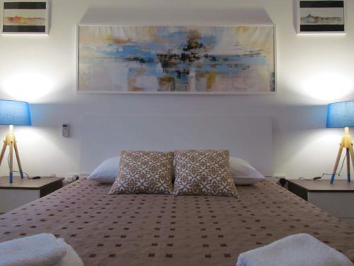 a bedroom with a bed with two pillows on it at Gianni Holiday Home in Pieta