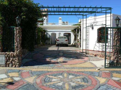 a car parked in front of a building at Hosteria Las Piedras in Puerto Madryn