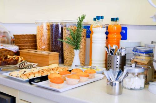 a counter with two plates of food and bottles of milk at Minu Hotel in Fethiye