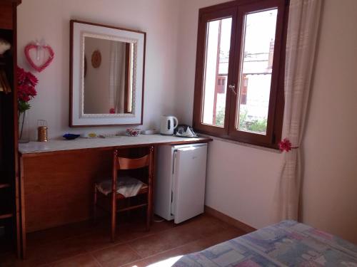 A bed or beds in a room at Canne Al Vento