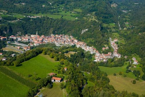 an aerial view of a small town in the mountains at Quader nidi nel verde in Bienno
