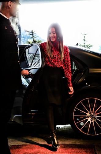 a woman is getting out of a car at Hotel Zhero – Ischgl/Kappl in Kappl