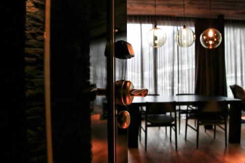 a dining room with a table and chairs and a dining room at Hotel Zhero – Ischgl/Kappl in Kappl