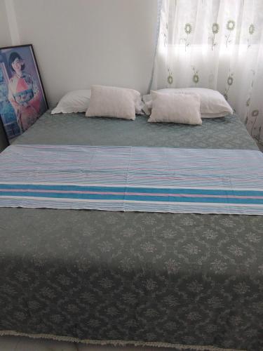 a bed with two pillows in a bedroom at VILLA ARIANNA in Wattala
