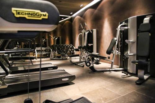a gym with several treadmills and cardio machines at Hotel Zhero – Ischgl/Kappl in Kappl