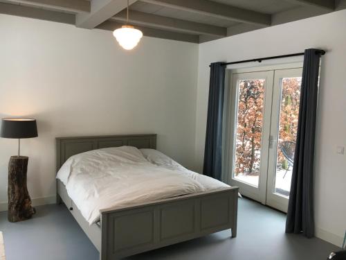 Postel nebo postele na pokoji v ubytování B&B Boerderij De Vaete - Duurzaam genieten in de zak van Zuid-Beveland