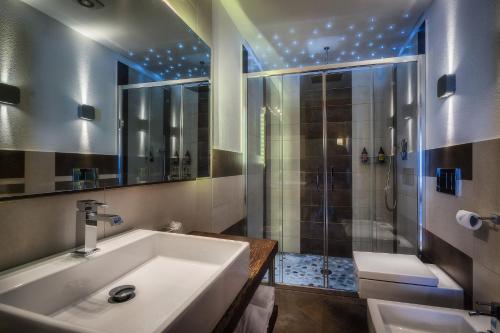 a bathroom with a sink and a shower at Albergo Nazionale in Vernante