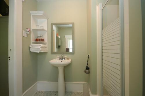 a bathroom with a sink and a mirror at Fisherman's Daughter B&B in Mahone Bay