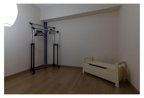 a room with a bed and a shelf in a room at Sealoft in Patra