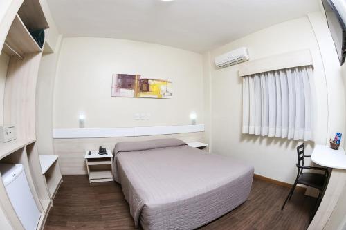 Cama o camas de una habitación en Hotel Express Rodoviária