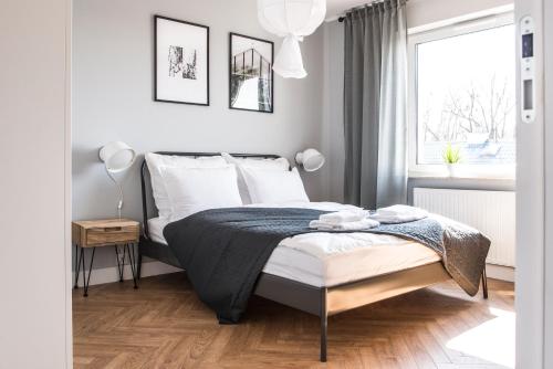 Posteľ alebo postele v izbe v ubytovaní Apartament przy Zachodnim