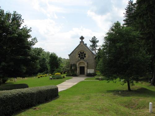 a church with a cross on the front of it at Chez Isa et Christophe in Mogeville