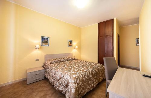 Postel nebo postele na pokoji v ubytování Hotel Aurelia