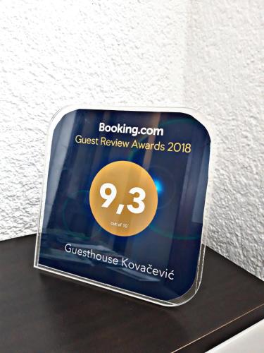 a sign that says guest review awards on a table at Guesthouse Kovačević in Korenica
