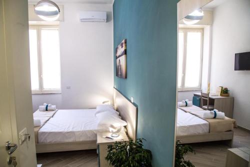 Postel nebo postele na pokoji v ubytování Borgo Angioino