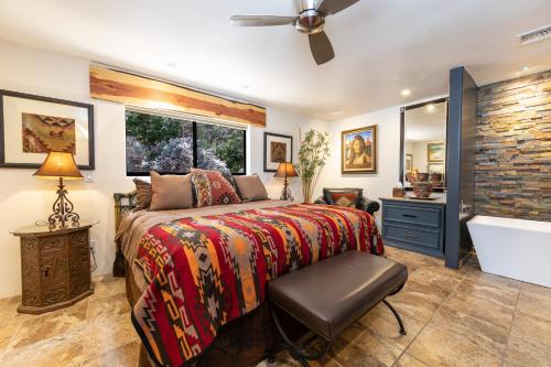 a bedroom with a bed and a bath tub at A Sunset Chateau in Sedona