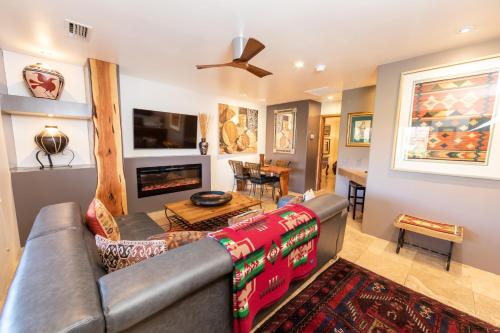 a living room with a couch and a fireplace at A Sunset Chateau in Sedona