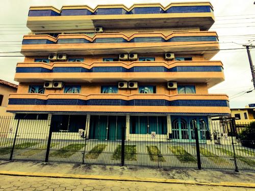 a building with a fence in front of it at Coliseu Palace Residence in Florianópolis