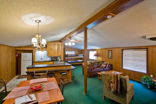 a kitchen and living room with a table and chairs at Panther Valley Ranch in Morning Star