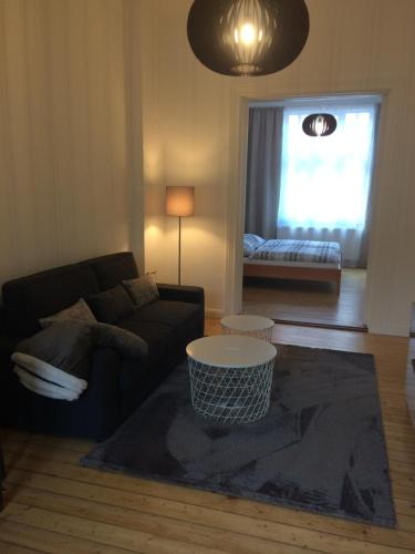 a living room with a couch and a coffee table at holiday-apartments in Bremen