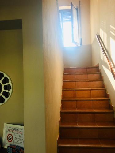a staircase in a building with a window at B&B dalLo Zio in Ottobiano