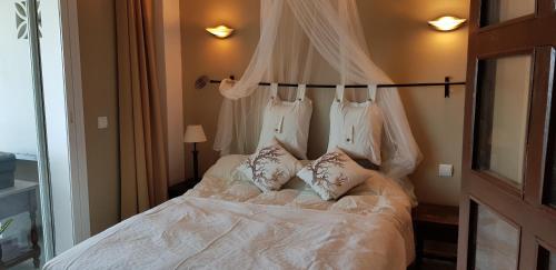 En eller flere senge i et værelse på Apartamento auténtico La Perla Playa