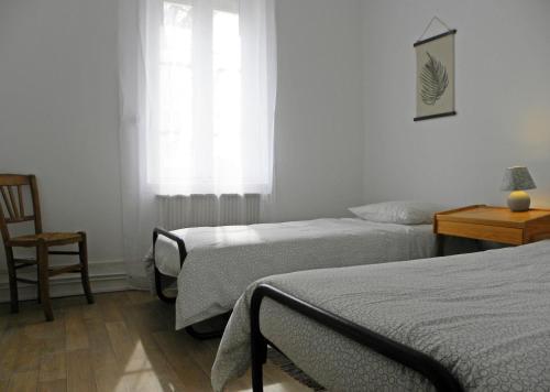 Postel nebo postele na pokoji v ubytování Les Sauges