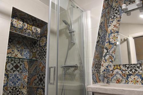 a bathroom with a shower and a sink at Casa Mida - Guest House in Pezze di Greco