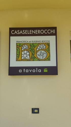 a sign is hanging on a wall at Casa Selene Rocchi in Savignano sul Panaro