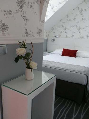 Кровать или кровати в номере Hotel Florescente