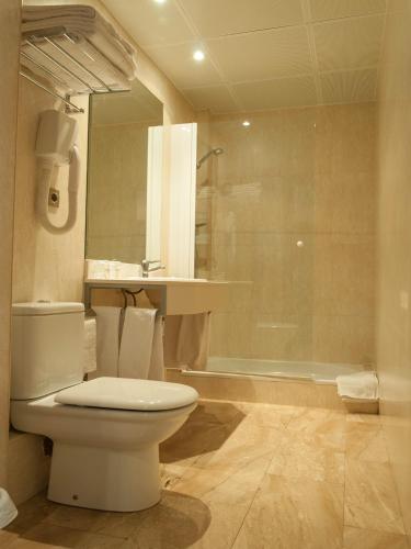 a bathroom with a toilet and a sink and a shower at Ramon Berenguer IV in Lleida