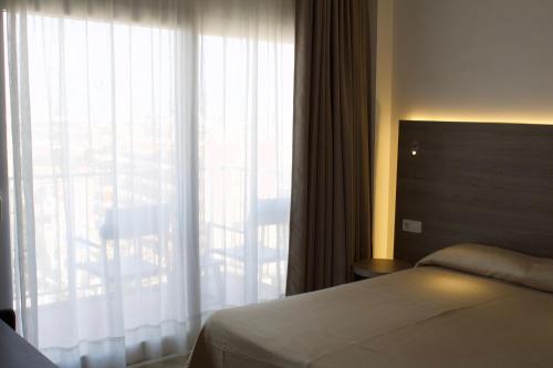 Postel nebo postele na pokoji v ubytování Hotel Vista Odin