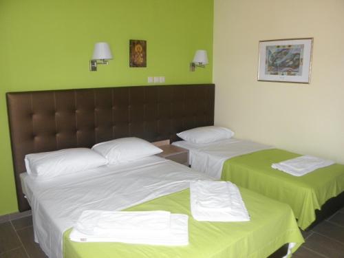 Ένα ή περισσότερα κρεβάτια σε δωμάτιο στο Makedonia Hotel 