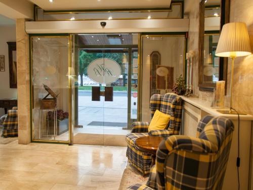 a living room with two couches and a glass door at Ramon Berenguer IV in Lleida