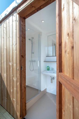 a bathroom with a shower and a sink at Marinaparcs Almere in Almere