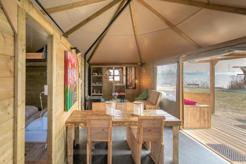 a wooden table inside of a tiny house at Marinaparcs Almere in Almere