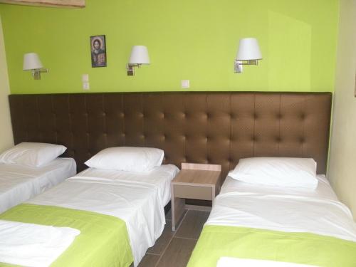 Ένα ή περισσότερα κρεβάτια σε δωμάτιο στο Makedonia Hotel 