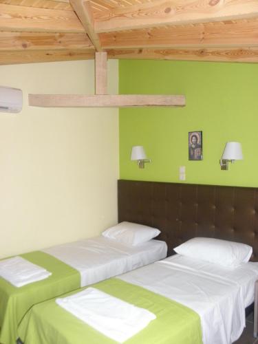 Ένα ή περισσότερα κρεβάτια σε δωμάτιο στο Makedonia Hotel 
