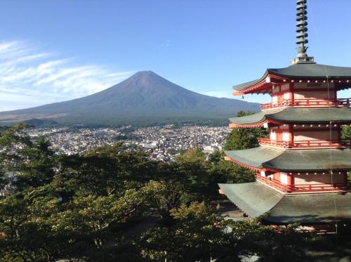 a pagoda with a mountain in the background at Habitacion NIIYA Mt Fuji in Fujikawaguchiko