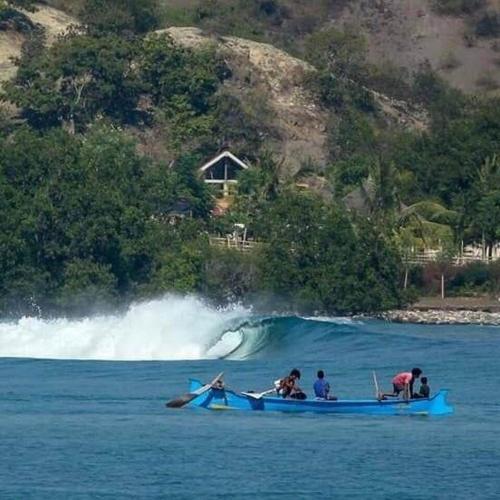 a group of people in a boat in the water at Boneputeh Homestay in Taliwang