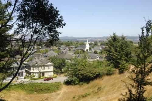 a view of a town from a hill with a house at Ye Olde Danish Inn in Ferndale