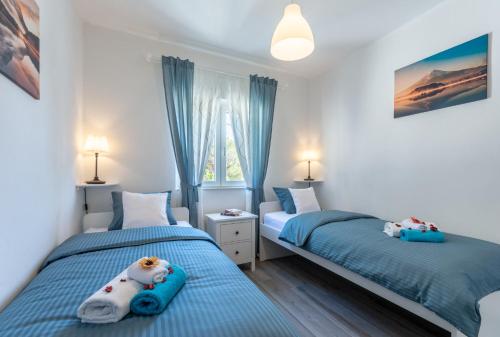 Ένα ή περισσότερα κρεβάτια σε δωμάτιο στο SeaView Apartment Toni