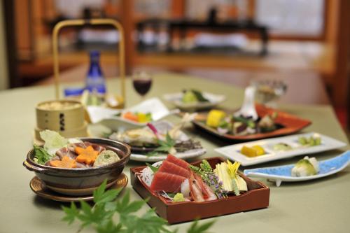 a table with several plates of food on it at Yumoto Itaya in Nikko