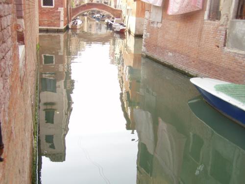 a view of a canal with a boat in the water at b&b allo squero in Venice